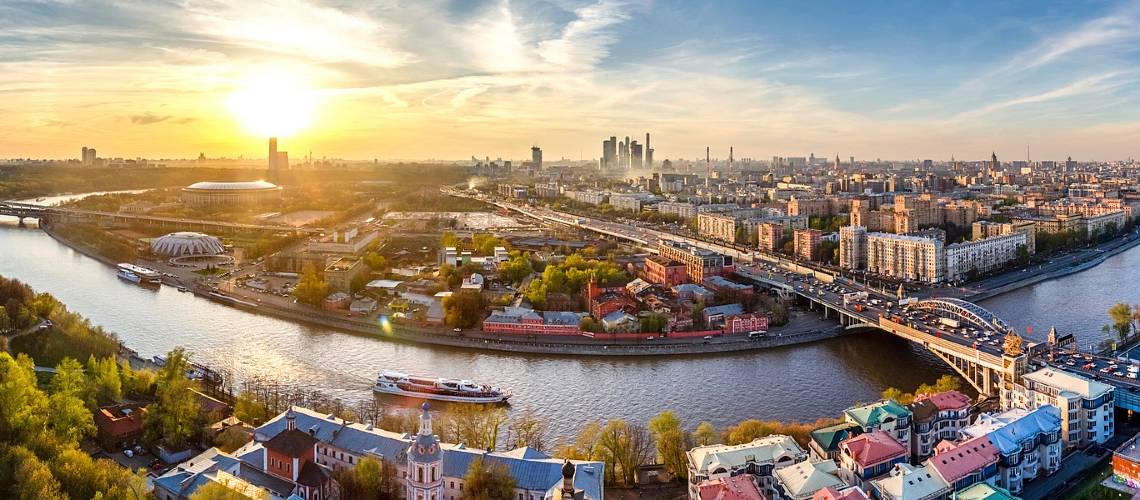 Panorama of a city with a cruise on the river