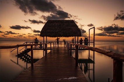 Sunset from thatched hut on bay